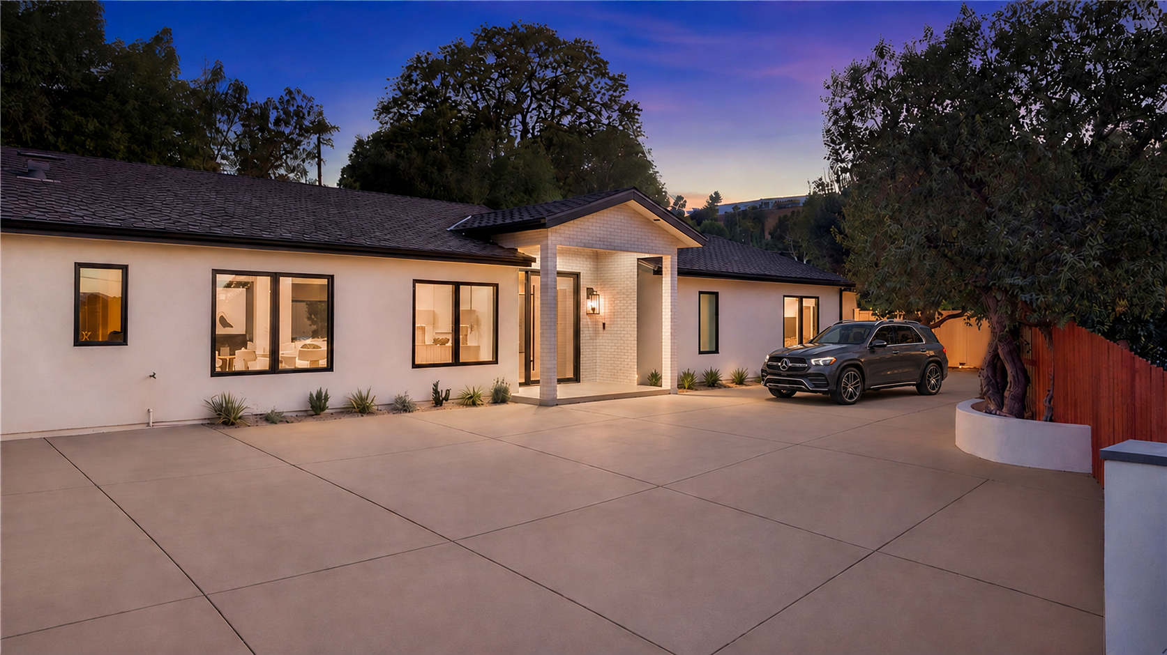 5200 Armida Drive at twilight with a dark gray Mercedes SUV parked back from the unobstructed entrance